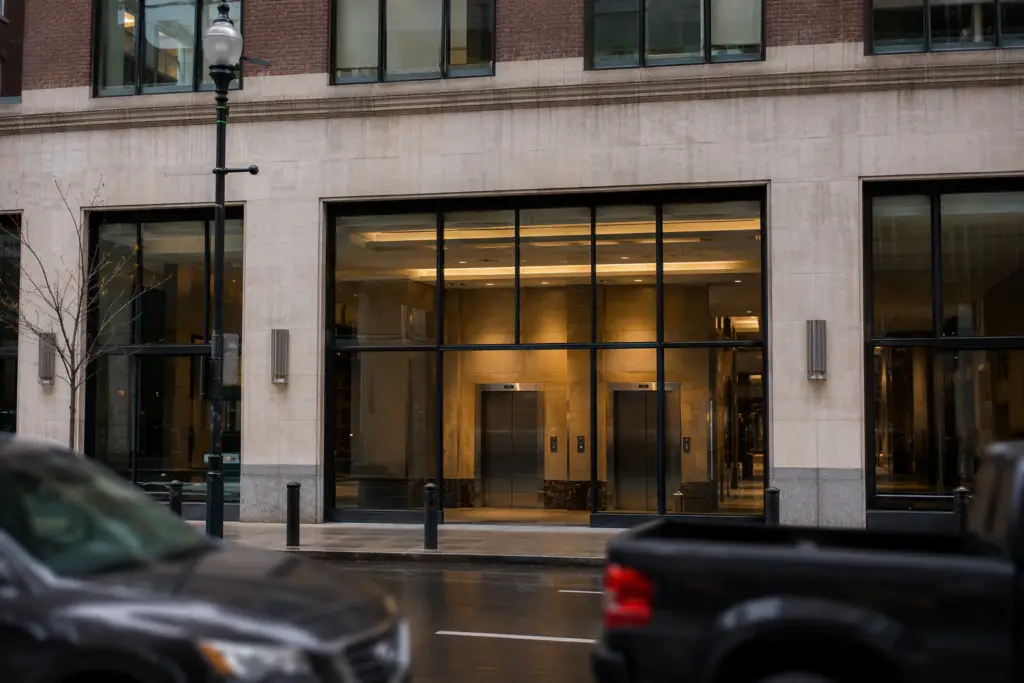 Center City Philadelphia mid-rise office building lobby showing two stainless steel elevator doors, representing professional elevator service in Philadelphia PA.