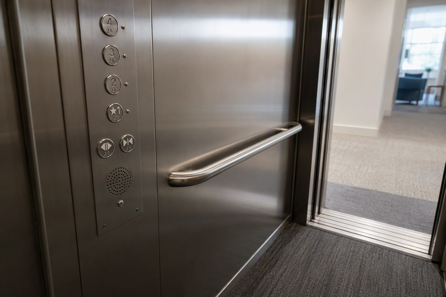 ADA-compliant elevator control panel with Braille buttons and two-way emergency communication system inside a Washington DC apartment building cab, showing multifamily accessibility requirements.