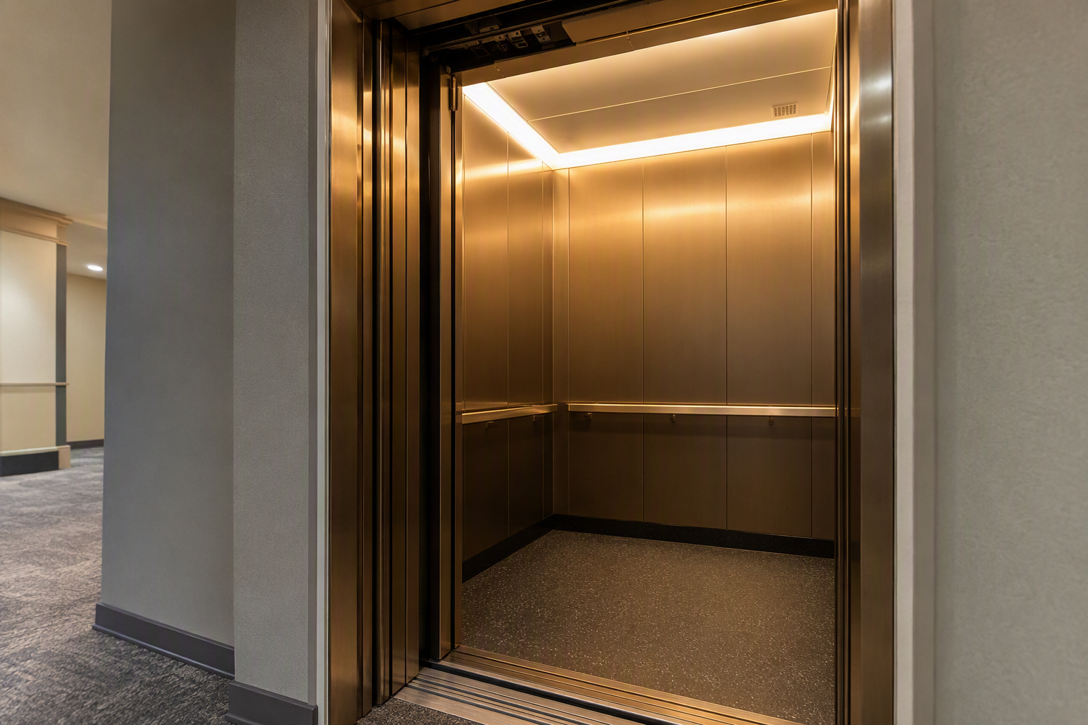 Modernized commercial elevator cab interior in a Philadelphia office building showing updated stainless-steel panels, LED lighting, and new door operator as part of a full-maintenance contract