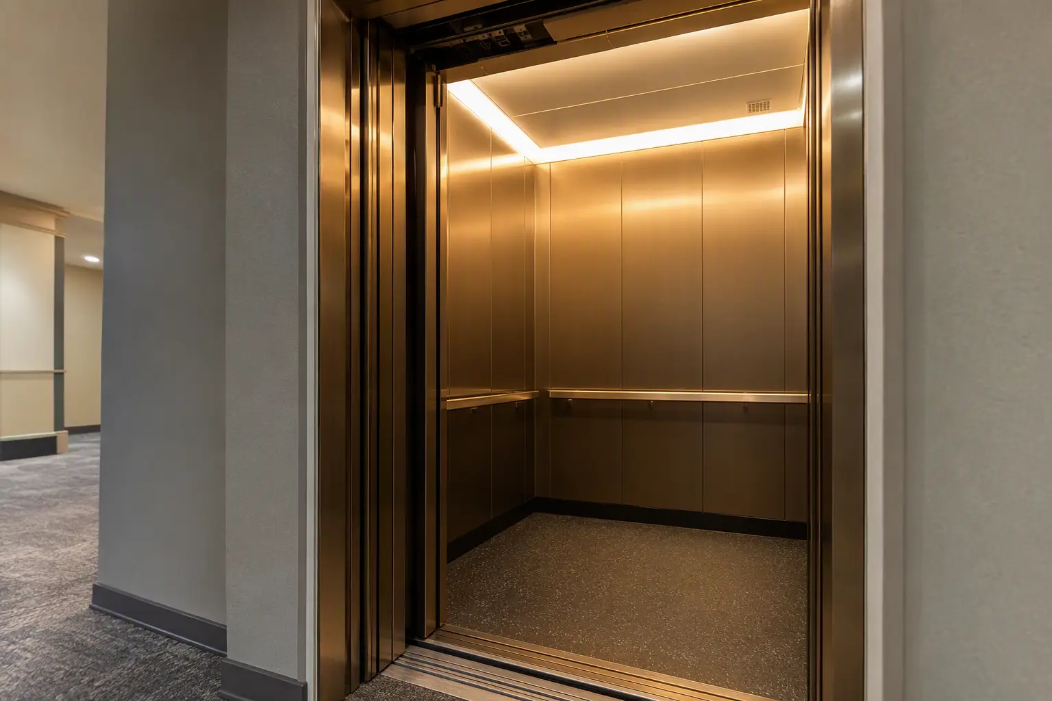 Modernized Elevator Cab Under Full Maintenance Coverage Modernized commercial elevator cab interior in a Philadelphia office building showing updated stainless-steel panels, LED lighting, and new door operator as part of a full-maintenance contract